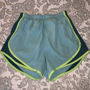 Blue Nike running shorts